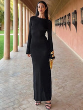 Full sleeve black and gold detail maxi dress shown for night out style